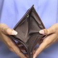 Person holding an empty wallet - showing bankruptcy